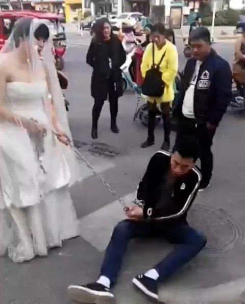 The groom was dragged to the wedding by the furious bride using a chain after he tried to run away.