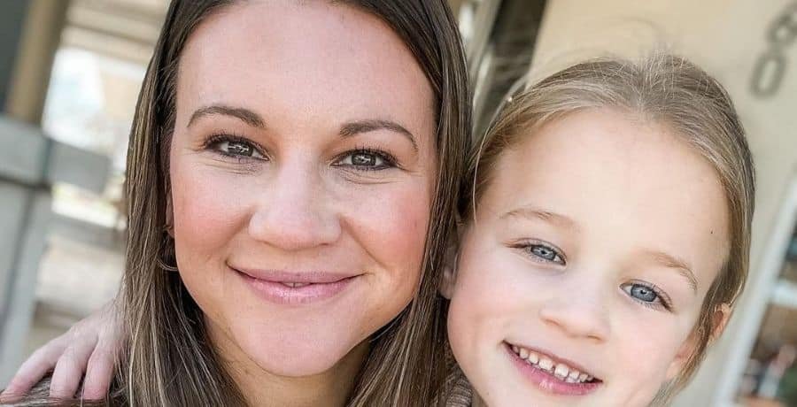 Danielle Busby with one of her quintuplet daughters
