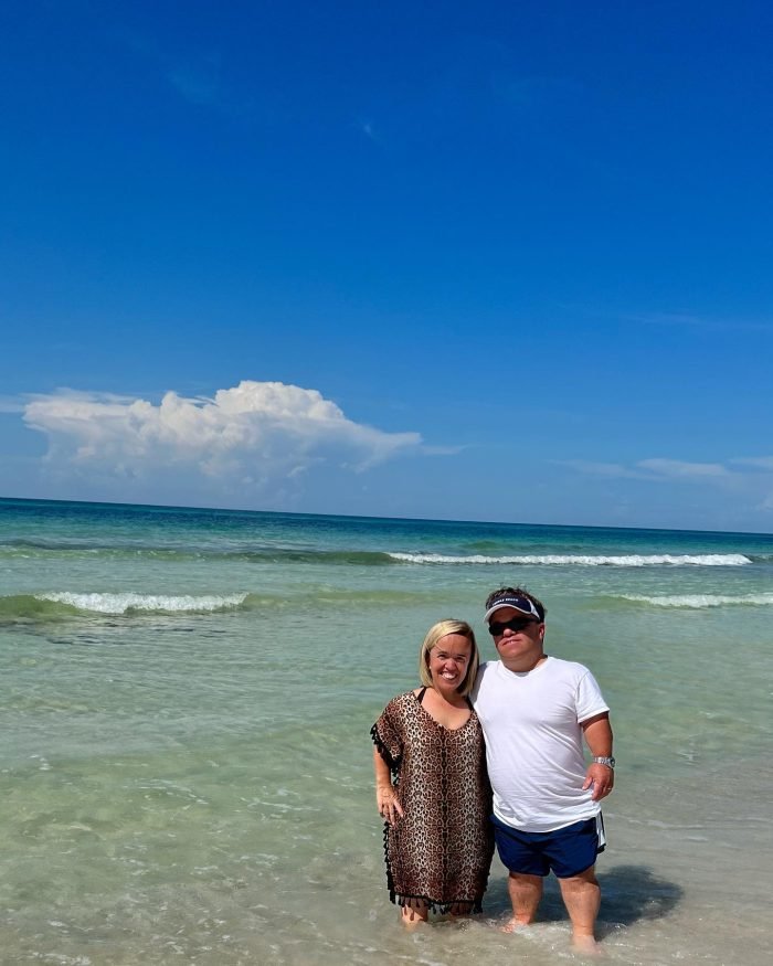 Trent and Amber Johnston smiling on the beach in Florida