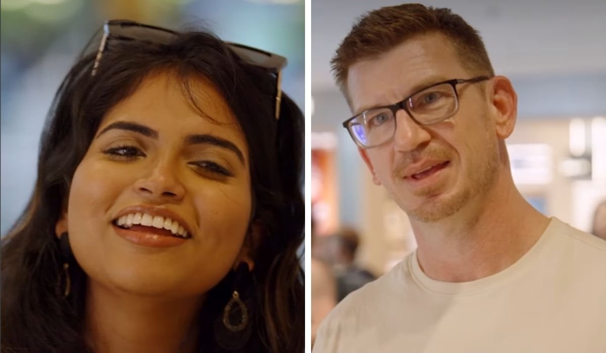 Ally smiling next to a tense-looking Jonathan