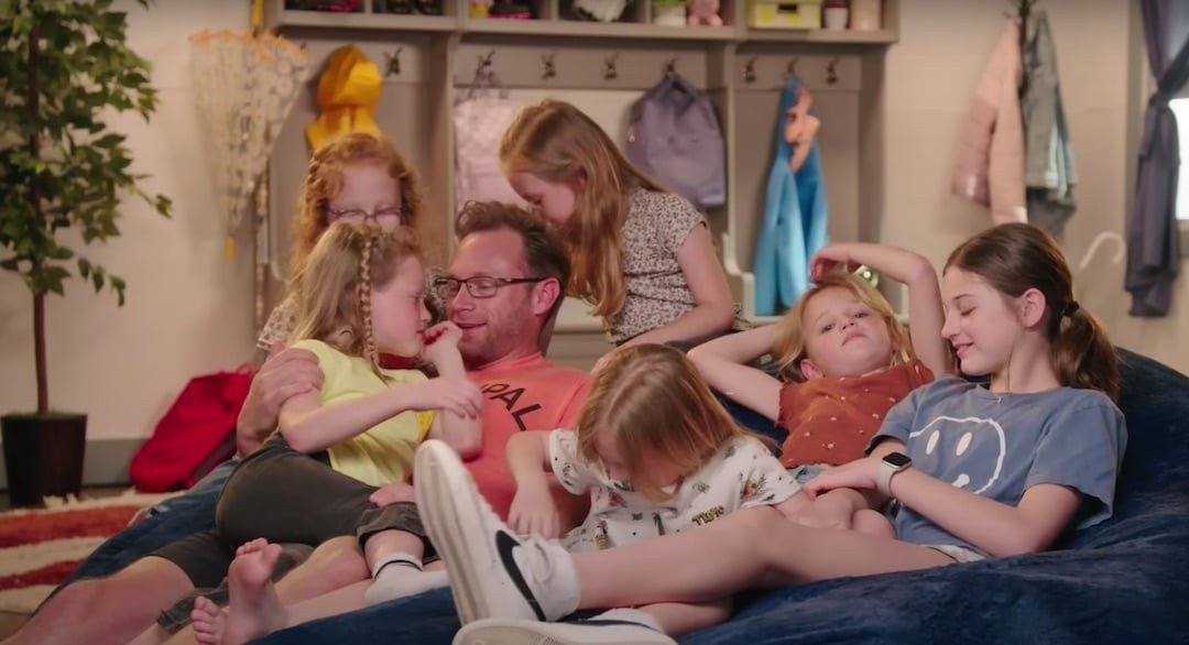 Adam Busby with Blayke and the Busby quintuplets on a beanbag