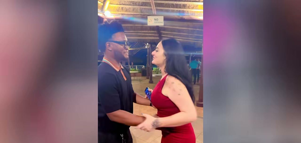 Michelle and Felix dancing together in Ghana