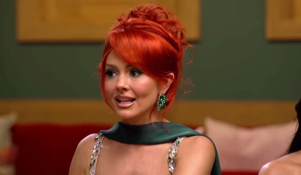 Kara Bass at a Tell All with red hair