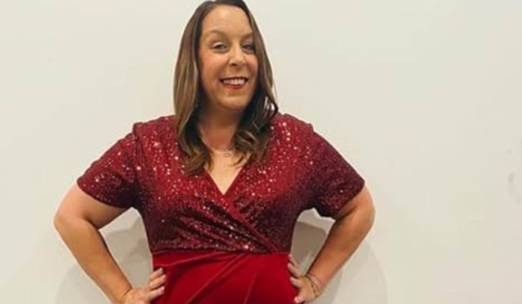 Kimberly Menzies in a red sequin dress