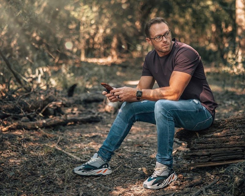 Adam Busby posing outdoors during a photoshoot