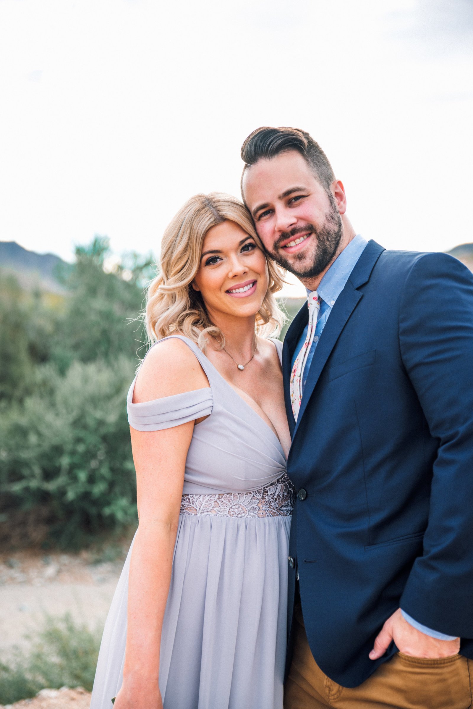 Adam and Danielle Busby posing together in formal wear