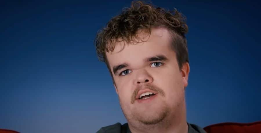 Jonah Johnston speaking in a confessional
