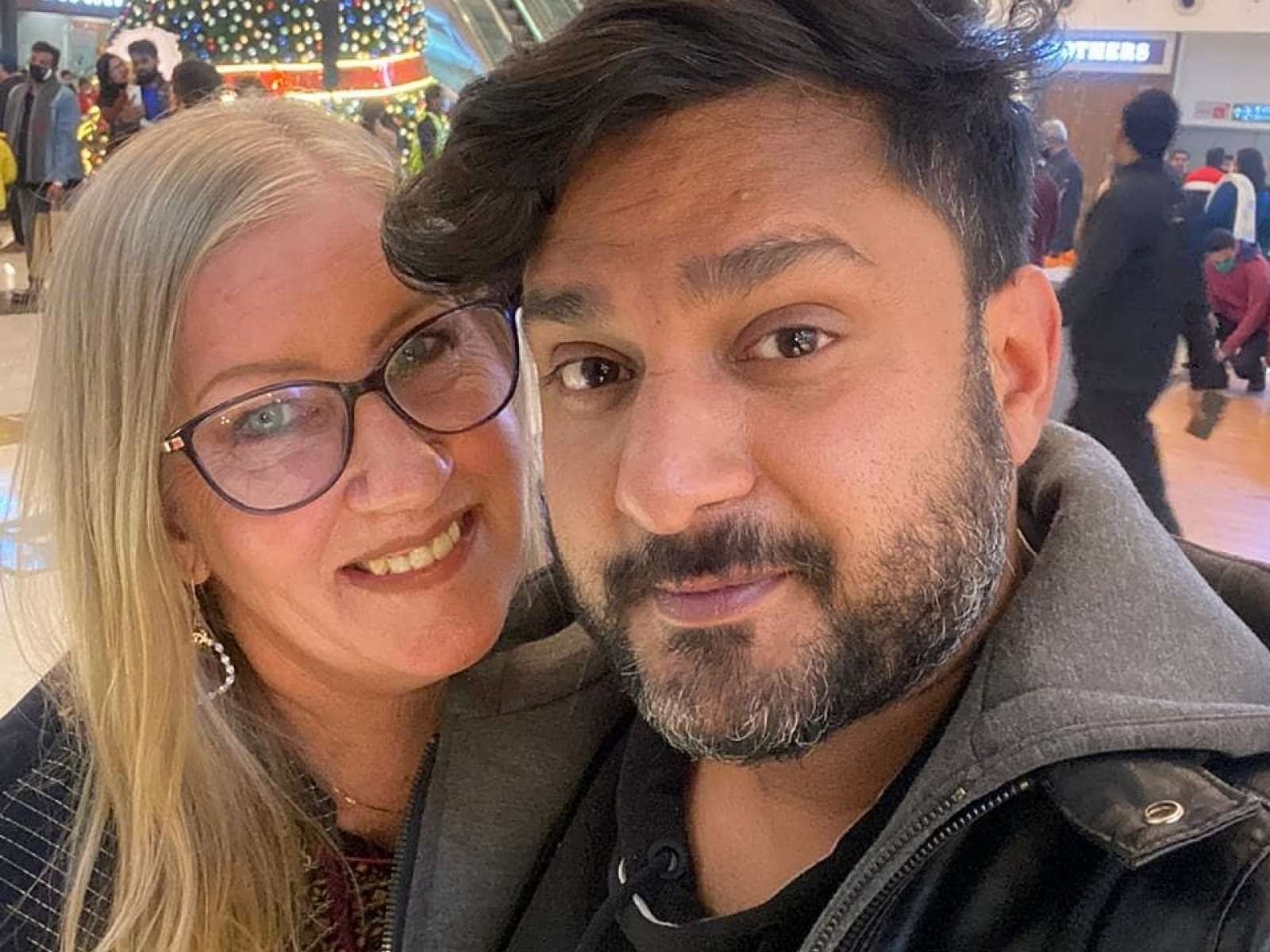 Jenny Slatten and Sumit Singh smiling in a selfie