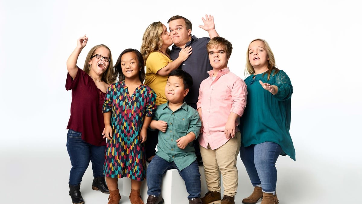 The Johnston family posing together in an earlier cast photo