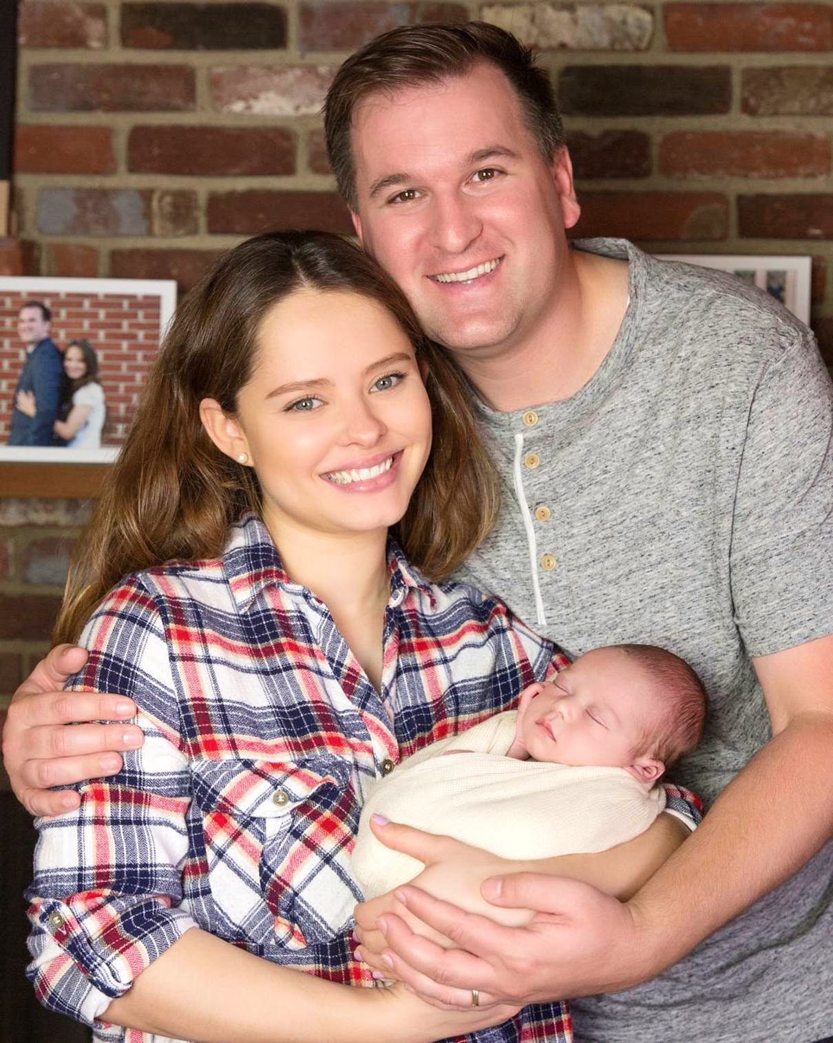 Alan and Kirlyam Cox holding their newborn baby