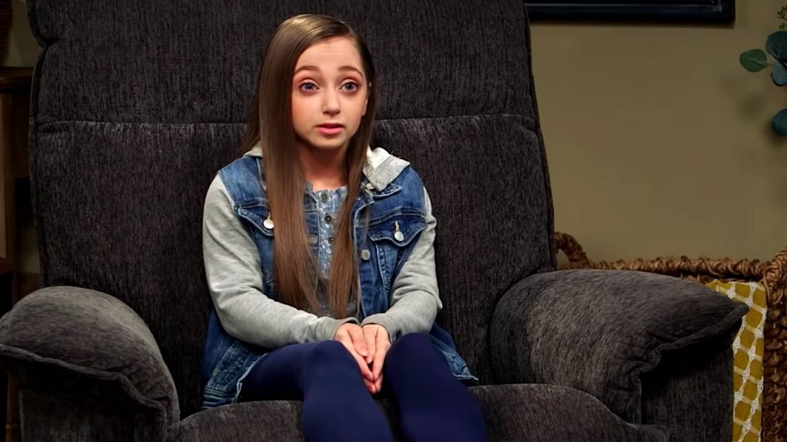 Shauna Rae sitting in a large chair during a confessional interview