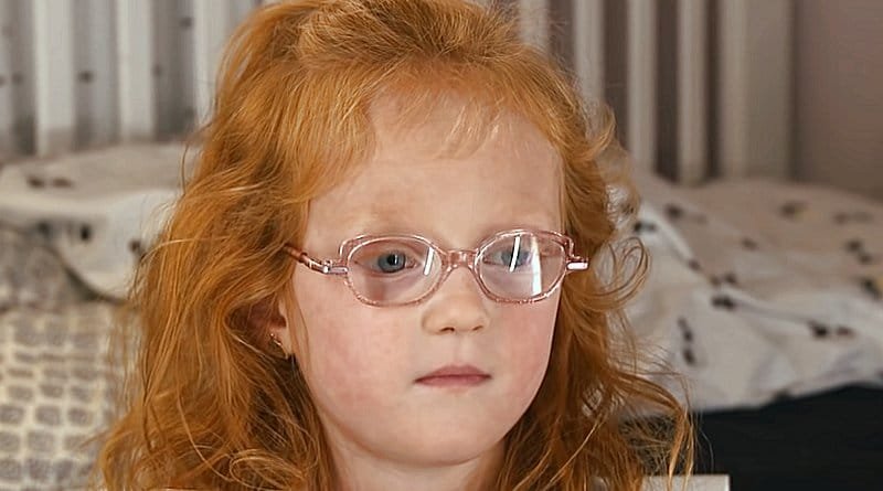 Hazel Busby close-up wearing pink glasses