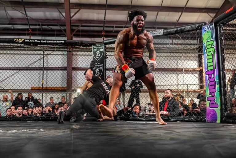 Lawrence Bishop fighting in an MMA cage