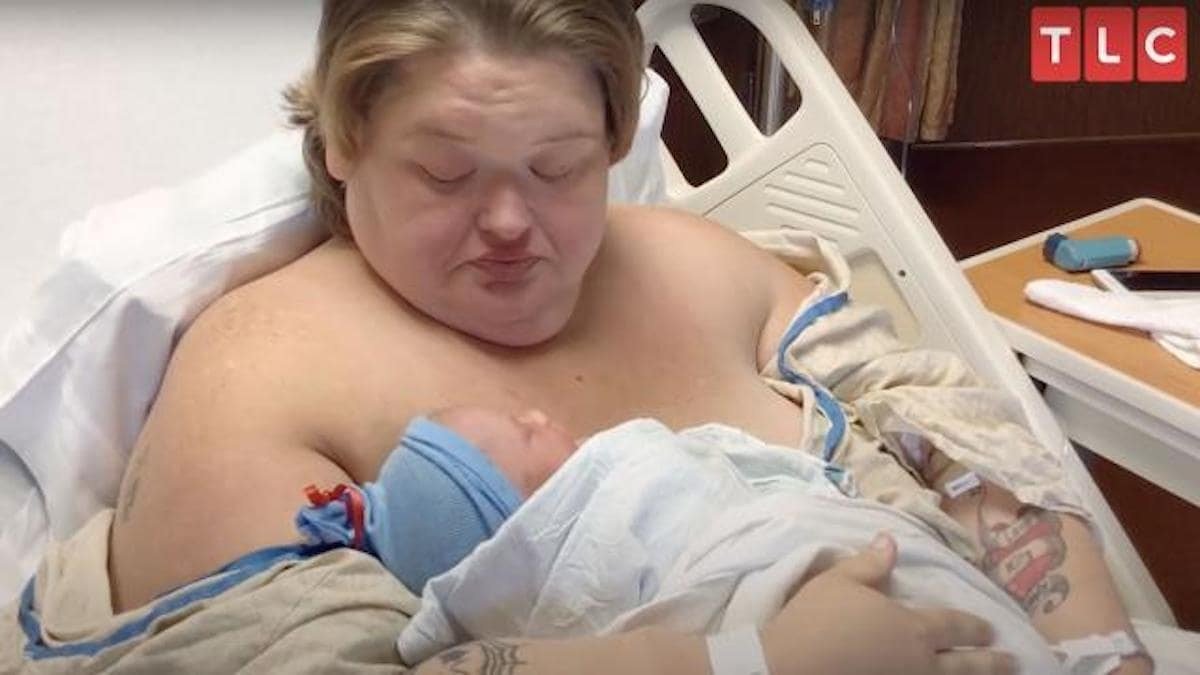 Amy Slaton holding her newborn baby in a hospital bed