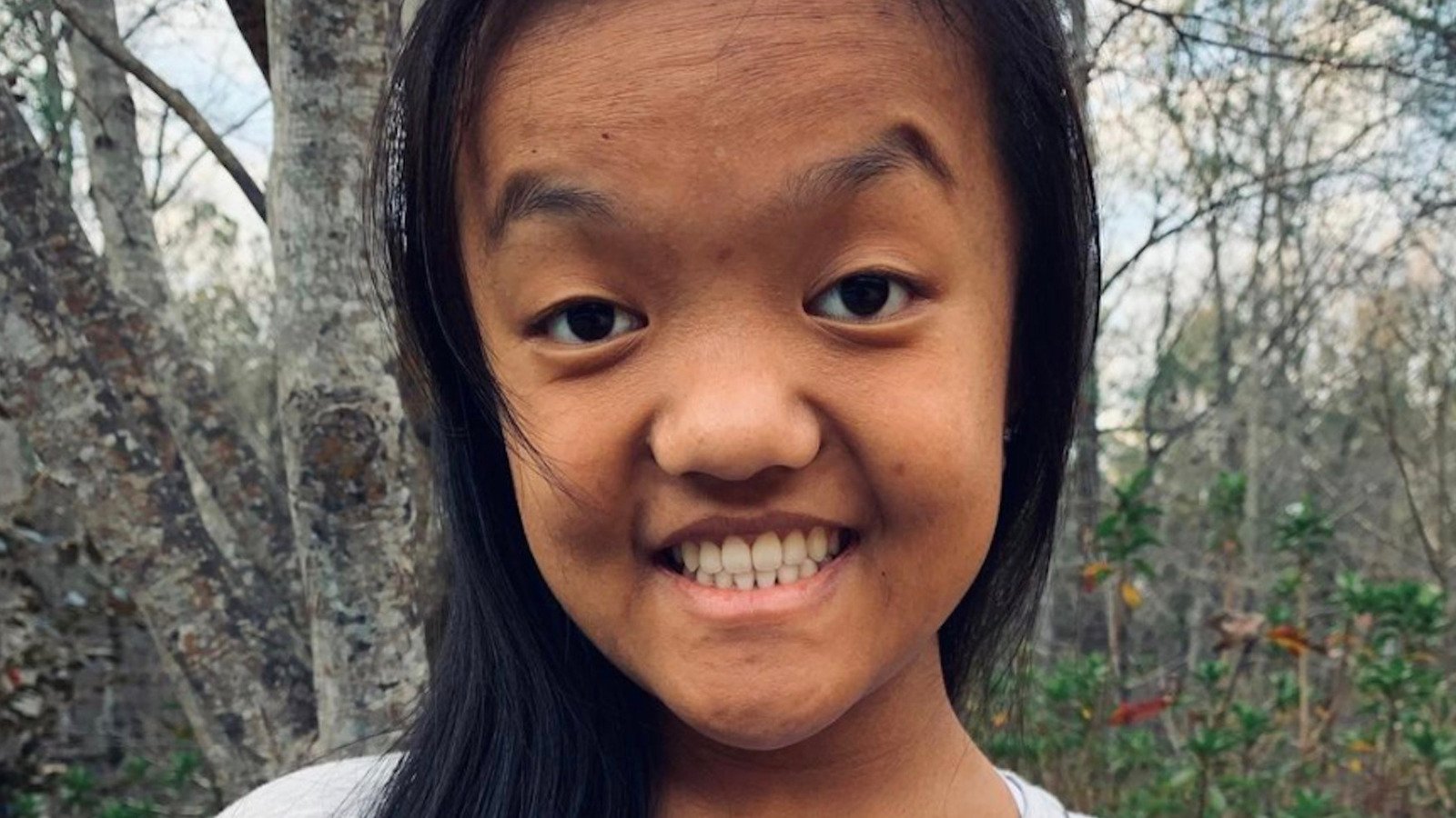 Emma Johnston smiling in a throwback portrait