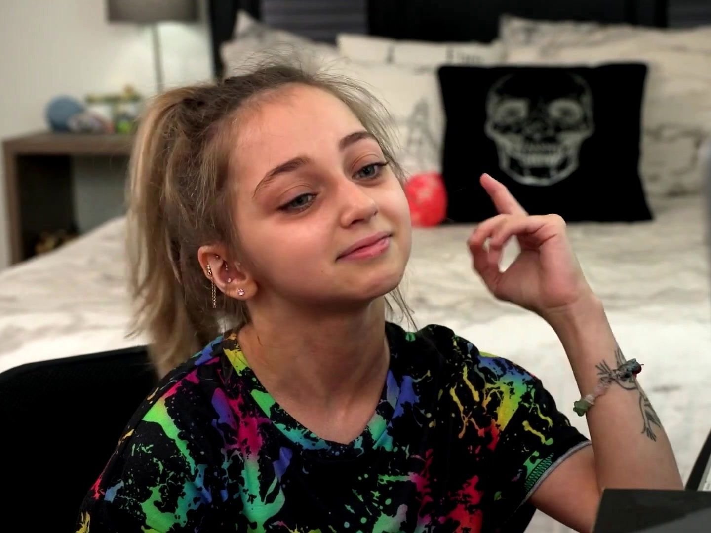 Shauna Rae at home in a colorful top