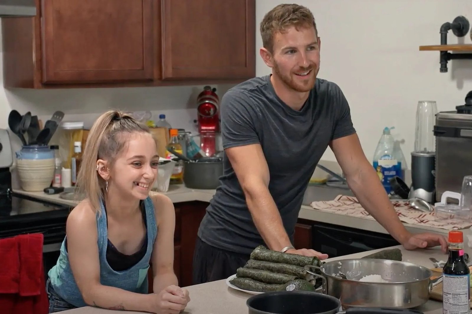 Shauna Rae and Dan Swygart making sushi in her kitchen