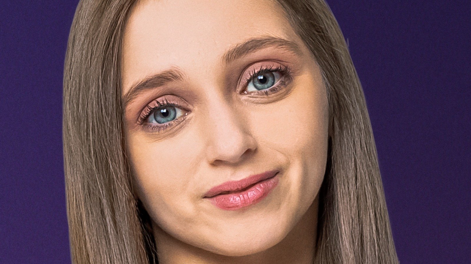 Shauna Rae smiling in a close-up portrait
