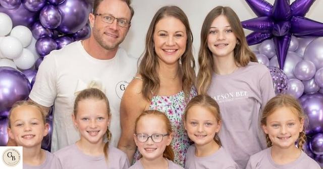 Adam and Danielle Busby with their daughters at a Graeson Bee event