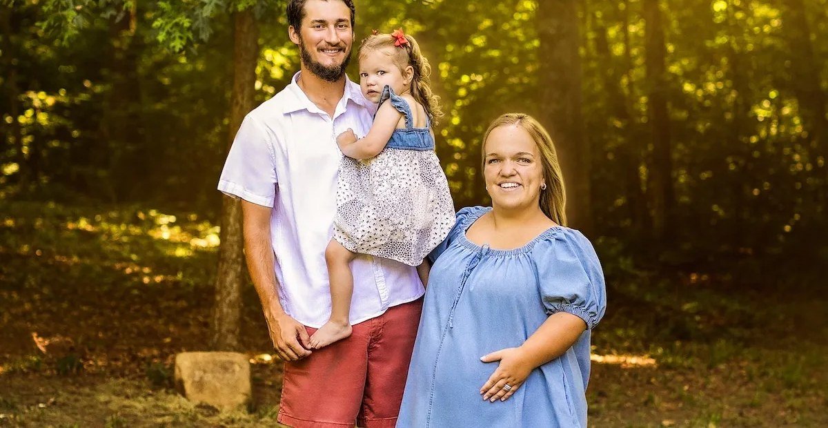 Liz Johnston, Brice Bolden and baby Leighton outdoors