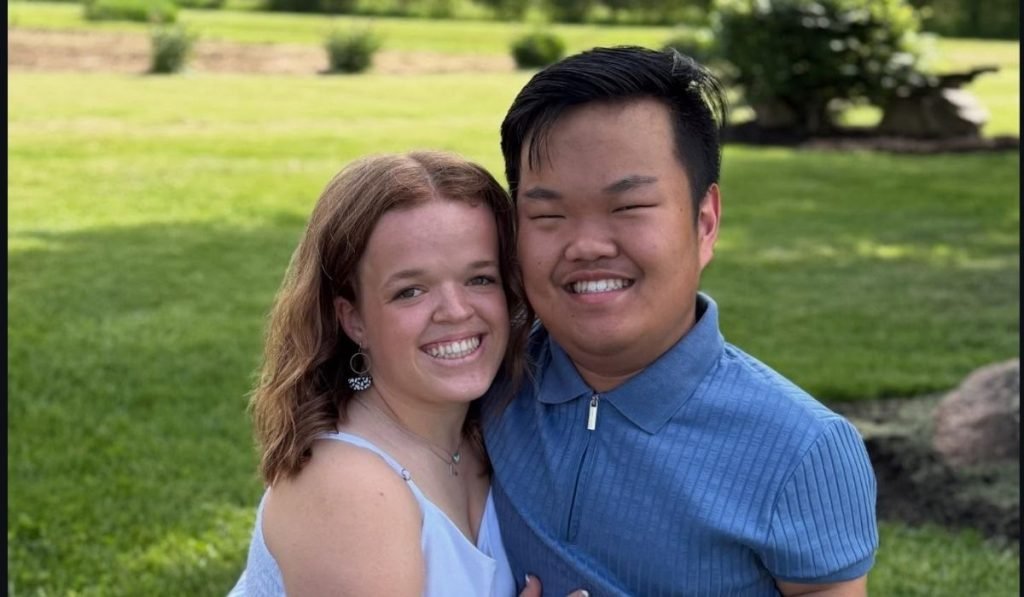 Alex Johnston and Allie Smith smiling together outdoors