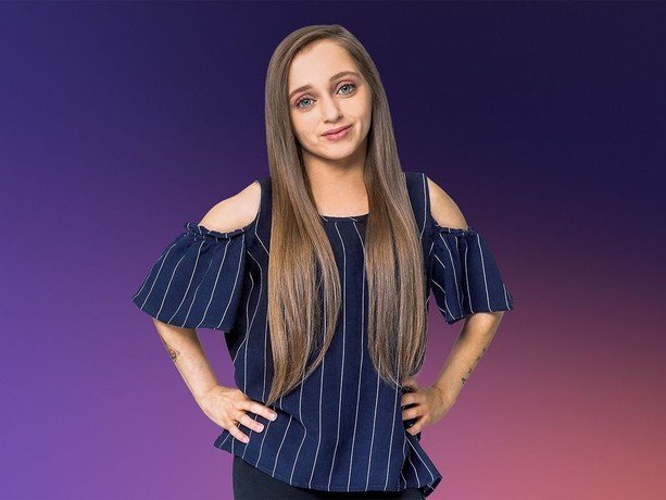 Shauna Rae posing confidently in a promotional portrait