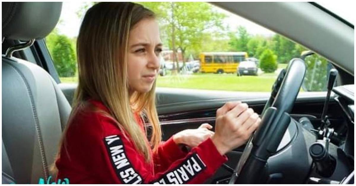 Shauna Rae driving a car with adaptive hand controls