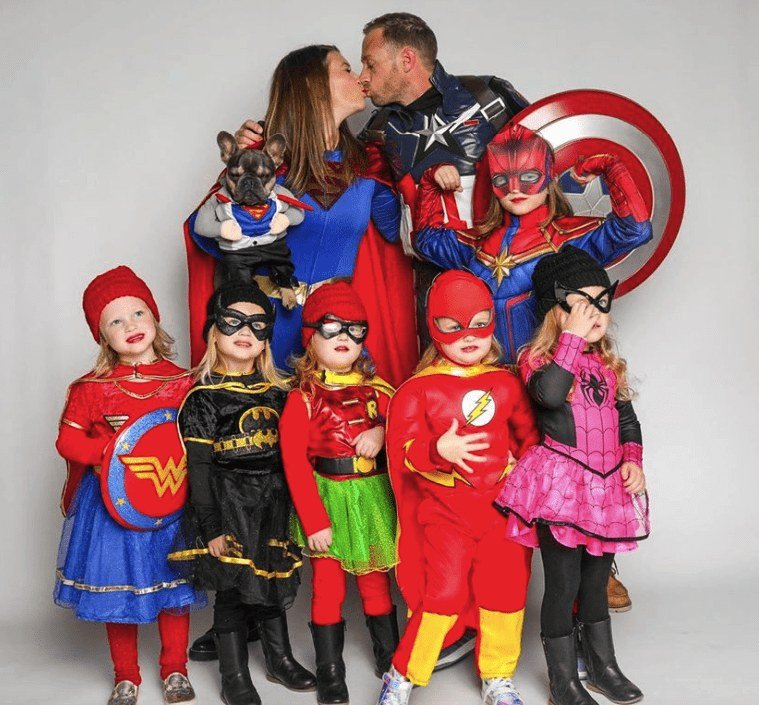 The Busby family dressed in superhero costumes for Halloween