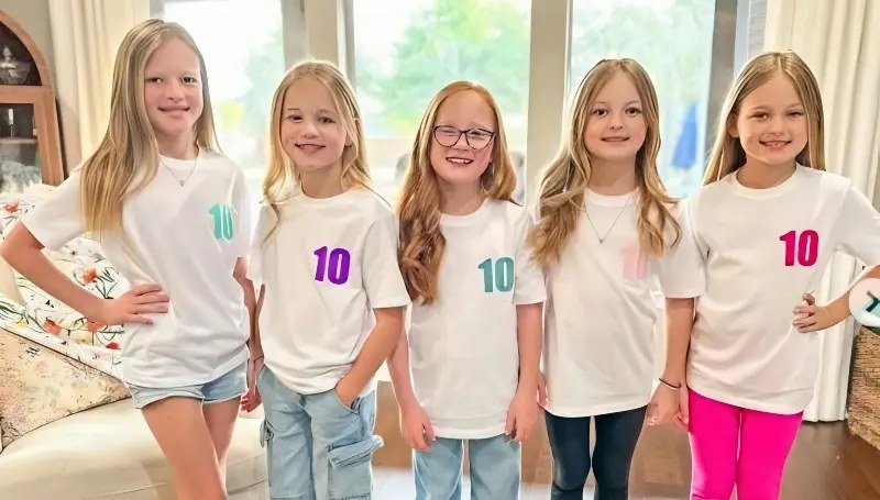 The five Busby quints wearing matching number 10 shirts for their tenth birthday