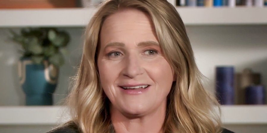 Christine Brown smiling in a confessional