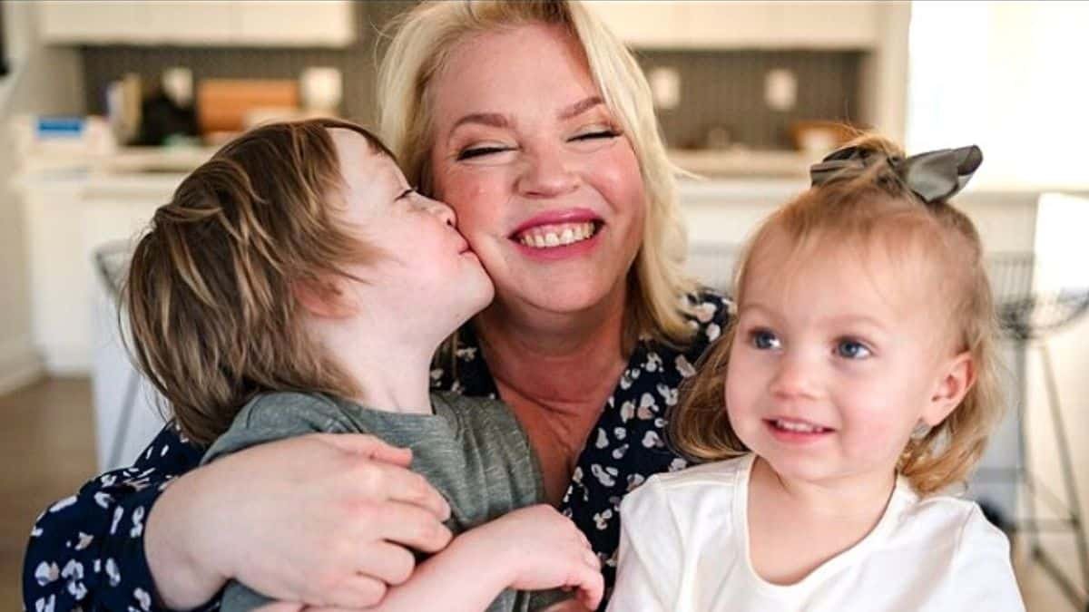 Janelle Brown laughing with her grandchildren Axel and Evie