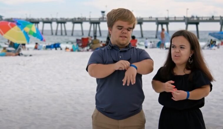 Jonah Johnston and Ashley on a beach