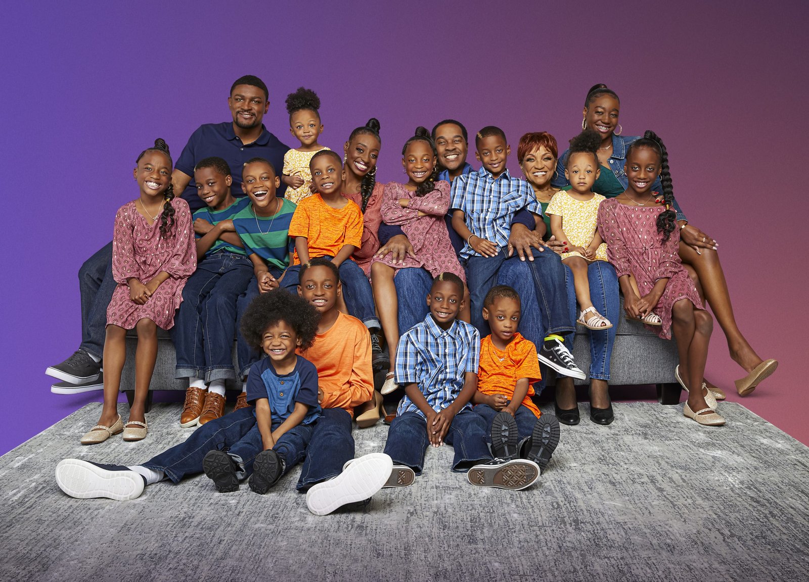 The Derrico family laughing together in a Season 3 group photo with GG
