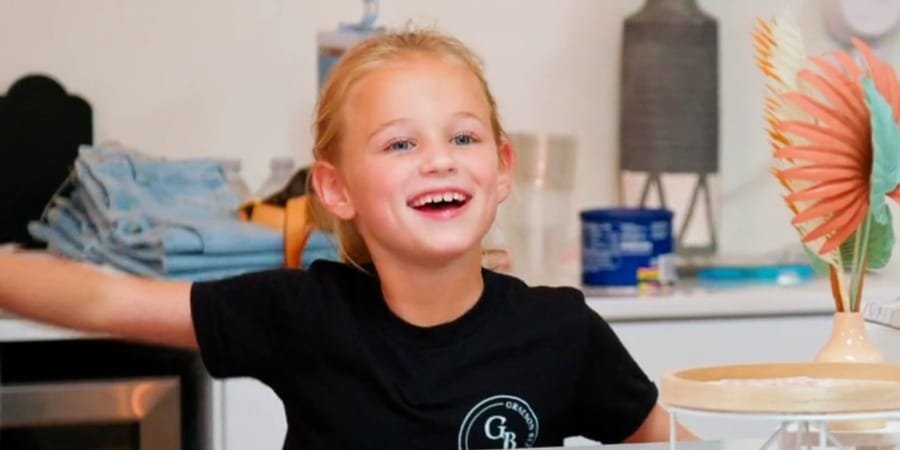 Riley Paige Busby laughing in a black shirt