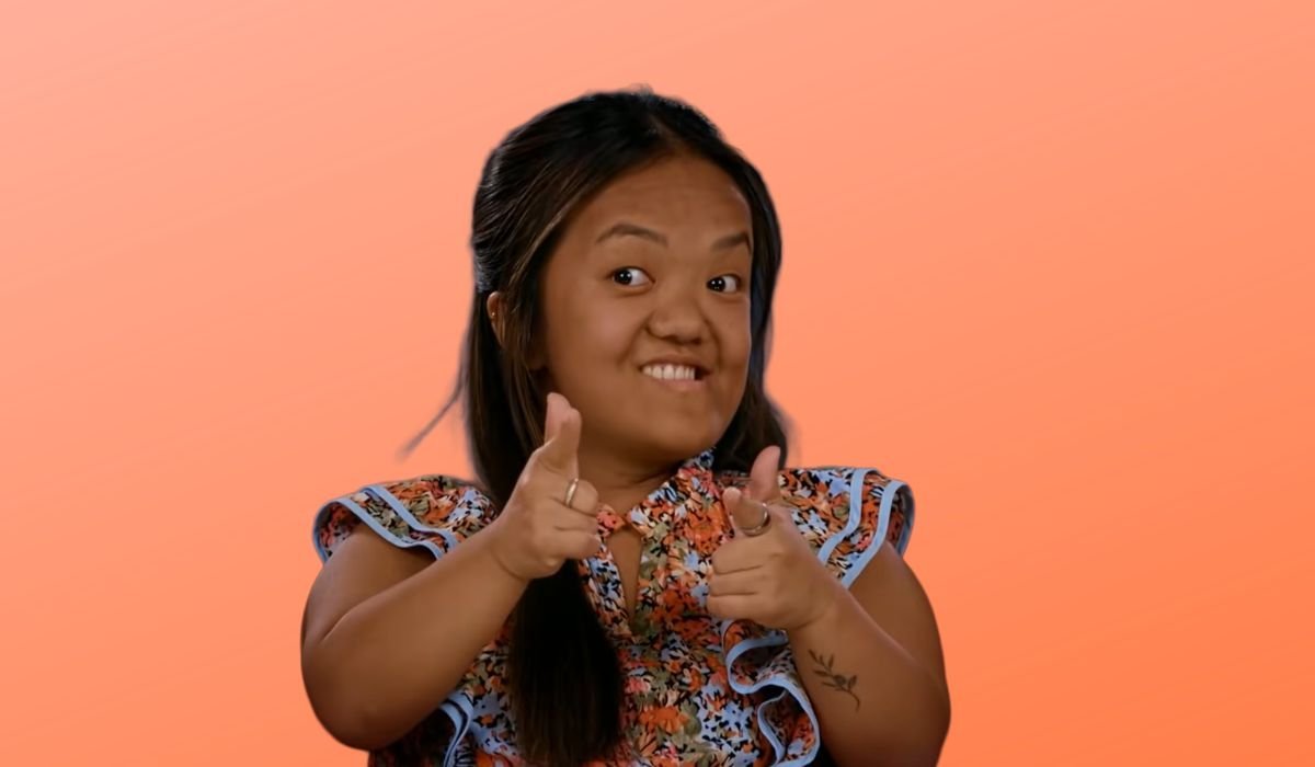 Emma Johnston smiling and giving a thumbs up