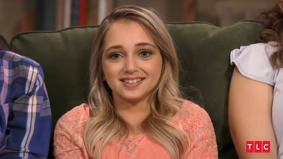 Shauna Rae sitting on a sofa during a confessional interview