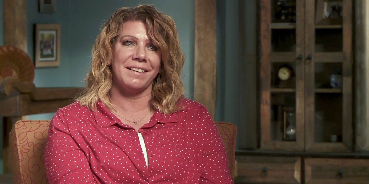 Meri Brown smiling in a confessional interview