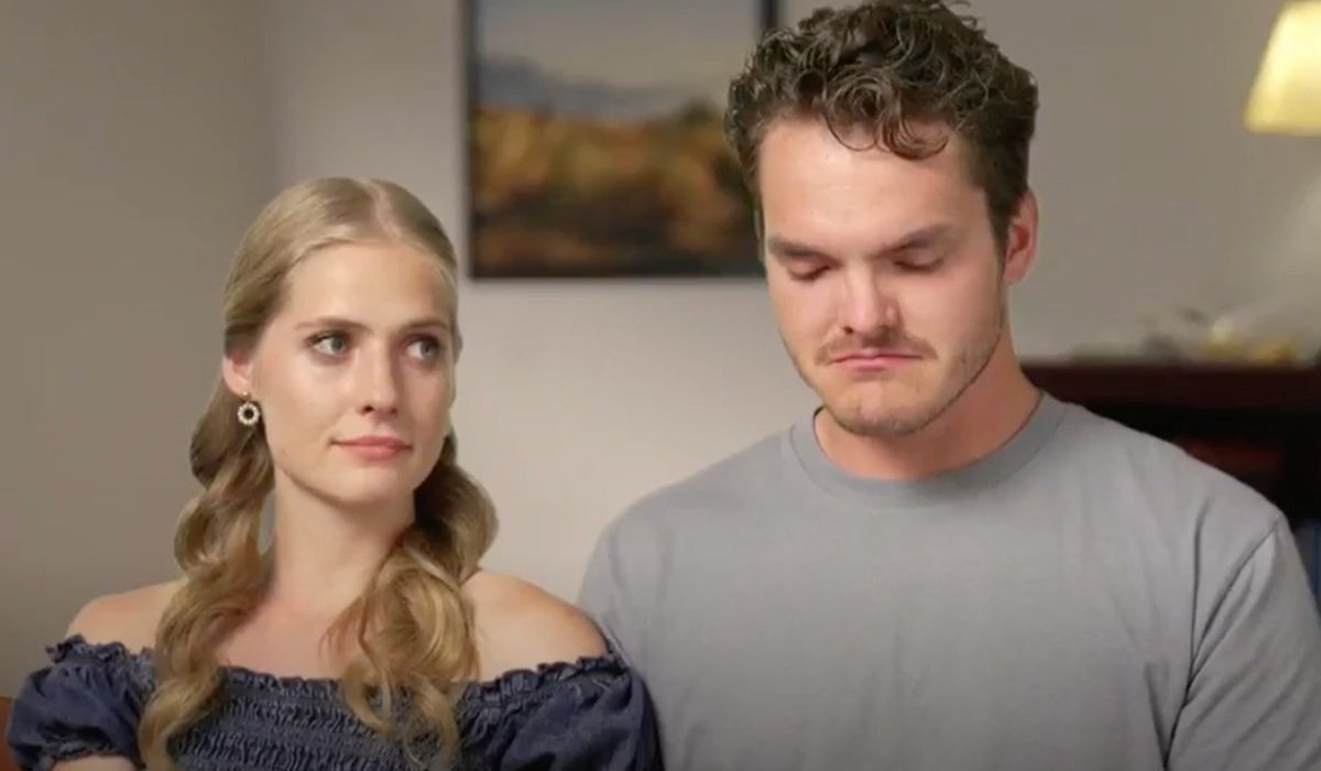 Lydia Plath Wyse and Zac Wyse in a confessional, looking emotional