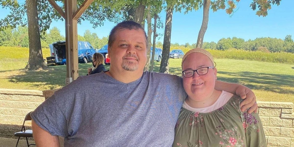 Chris Combs and Brittany Combs posing together outdoors
