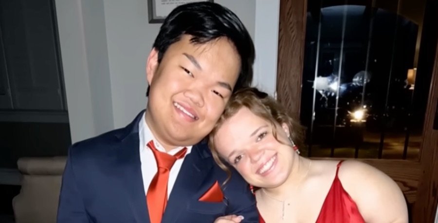 Alex Johnston and Allie Smith cheek to cheek at a dance