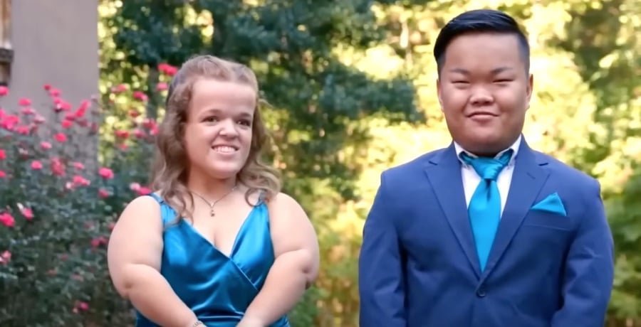 Alex Johnston and Allie Smith dressed up and smiling outdoors