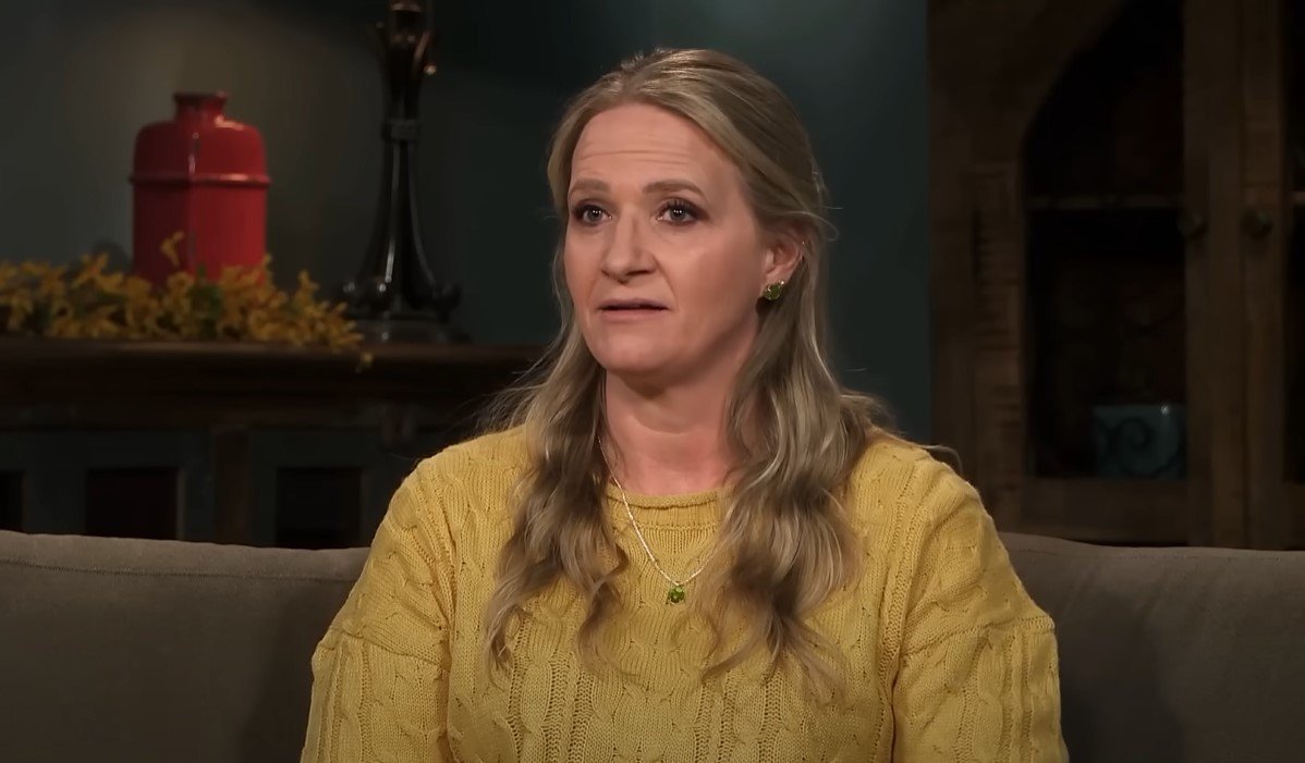 Christine Brown looking serious in a confessional interview