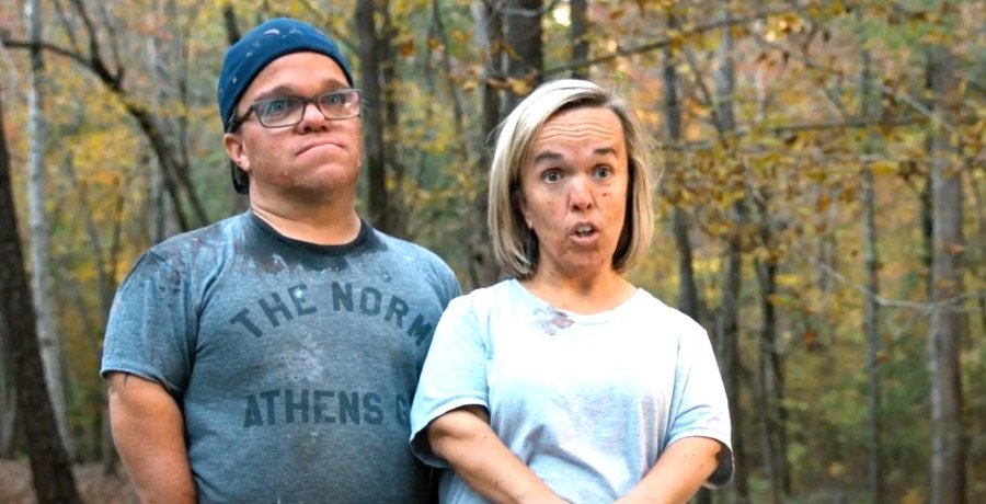 Amber Johnston speaking passionately outdoors with Trent beside her