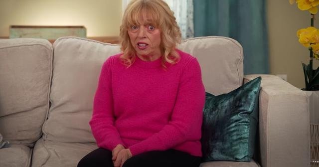 Tina sitting alone on a sofa