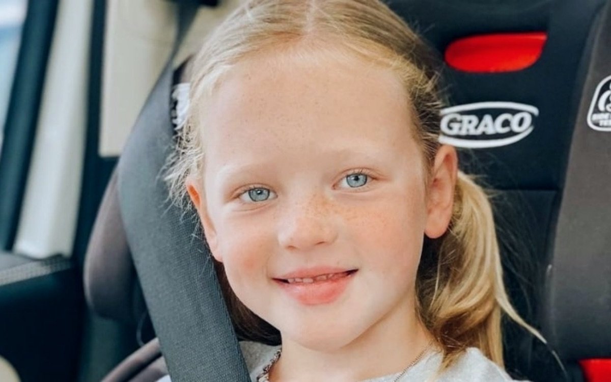 Parker Kate Busby smiling close up in a car seat