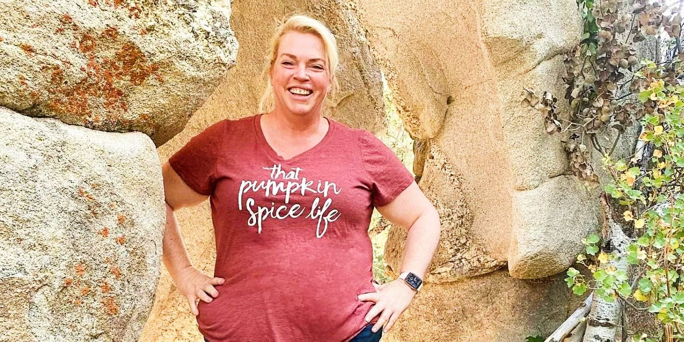Janelle Brown smiling outdoors among rocks