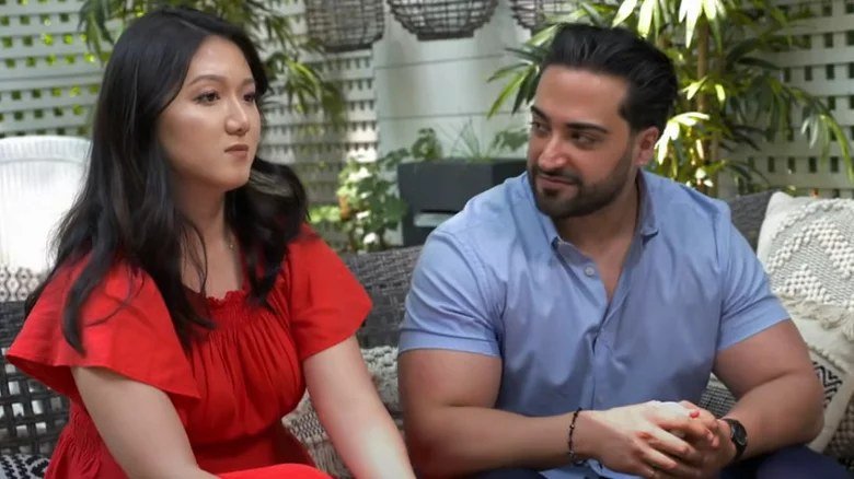 Emily Chu and Shekeb sitting together outdoors