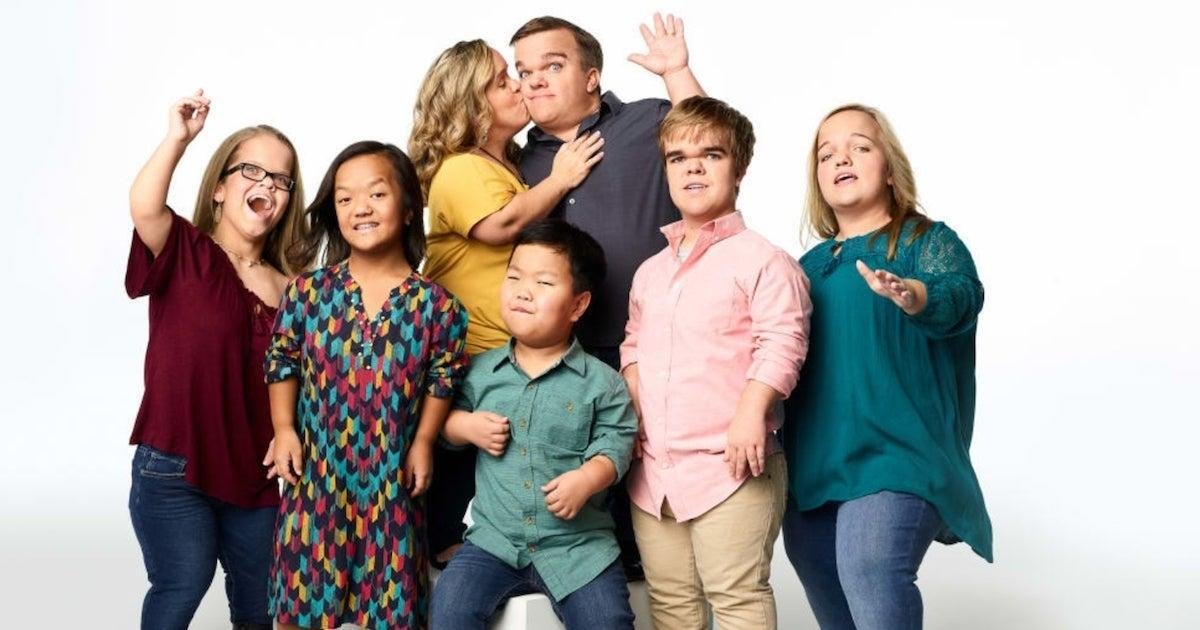 The Johnston family posing together in a studio portrait