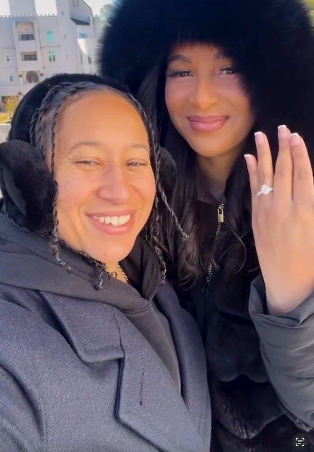 Chantel Everett and Ashley Bowen at their castle proposal, showing the ring
