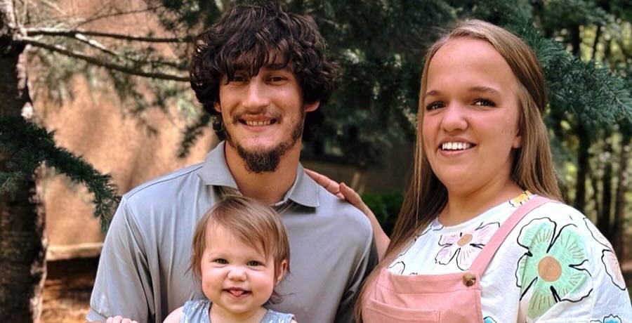 Liz Johnston, Brice Bolden and their daughter Leighton outdoors